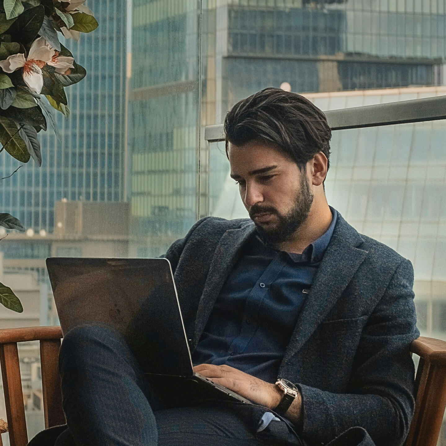 Business Man Man using the Feedback Tool while sitting on couch.